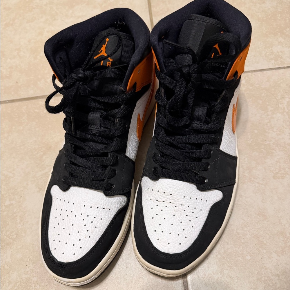 Jordan 1 Men's Black, White, and Orange Sneakers